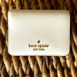 Kate spade mini wallet.  White w/ tan interior.  Brand new.